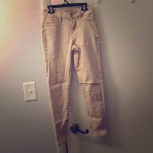 Light pink jean pants.